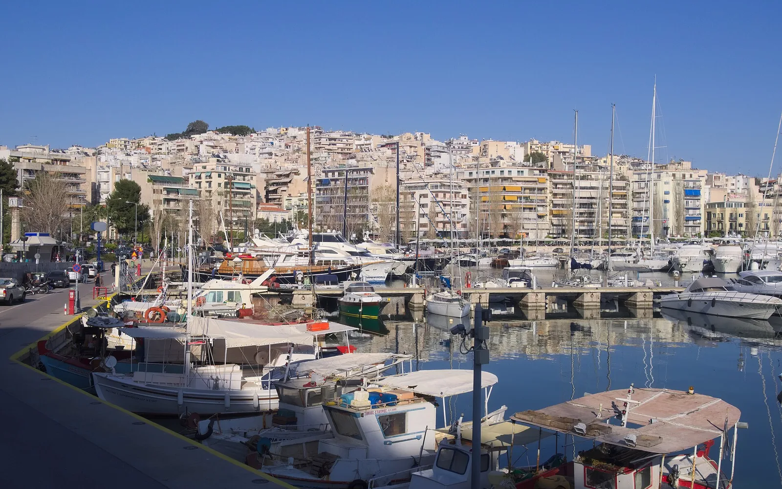 Boats and waterfront buildings at Marina Zeas in Piraeus